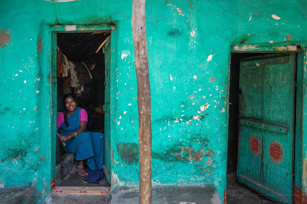 smiling woman India colourful home
